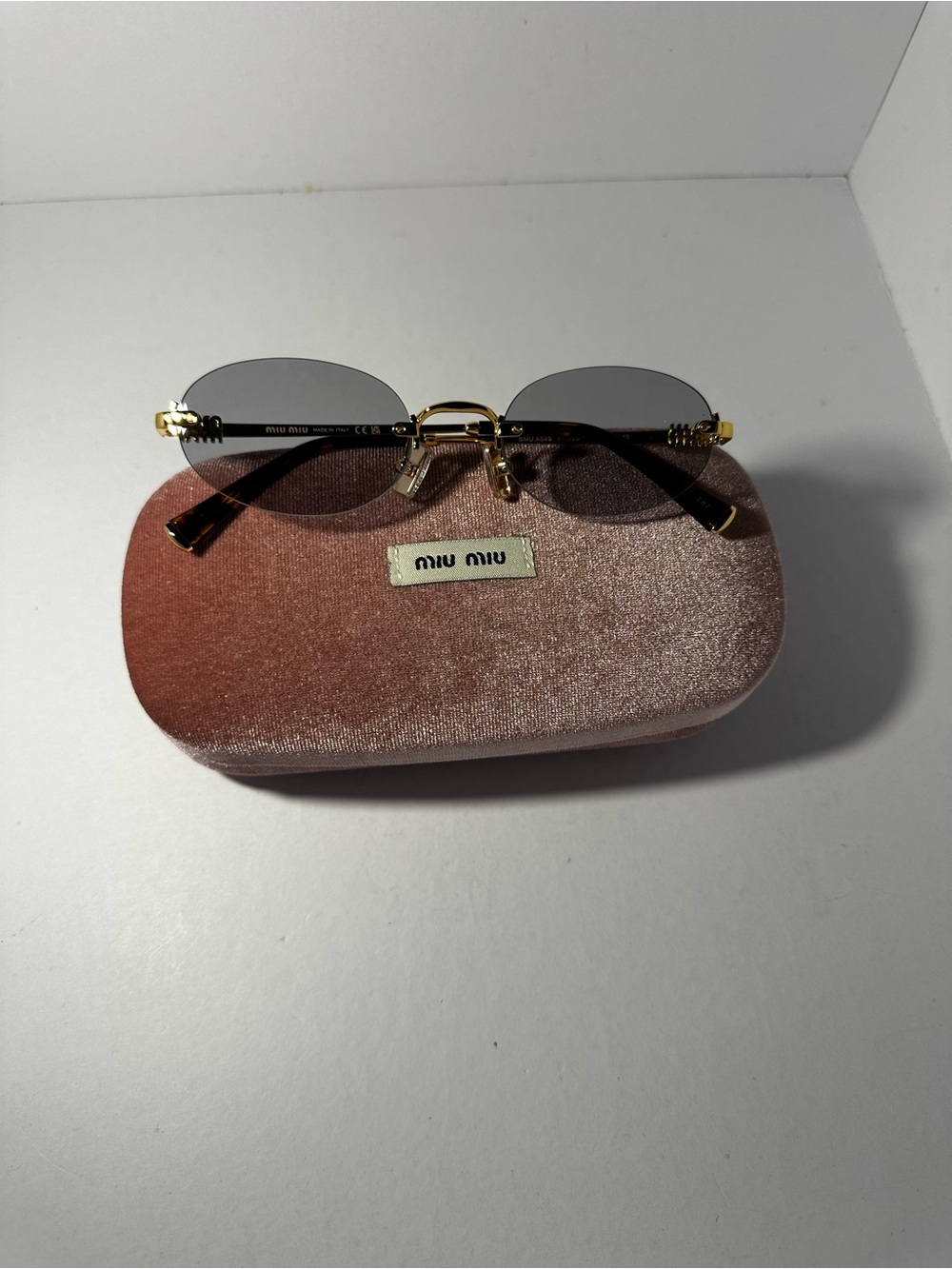 Miu Miu Rimless Sunglasses in Blue and Gold
